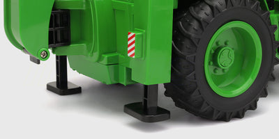 Traktor med støtteben og store hjul