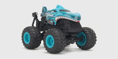 Orange Firedance Stunt Truck fjernstyret bil med store dæk klar til vilde hop og stunts.