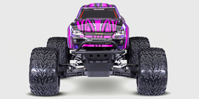 Orange Traxxas Stampede monster truck med store dæk og robust affjedring til offroad kørsel.