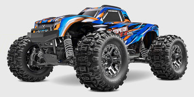 Traxxas Stampede 4x4 VXL fjernstyret monster truck i orange med store offroad dæk vist fra siden.