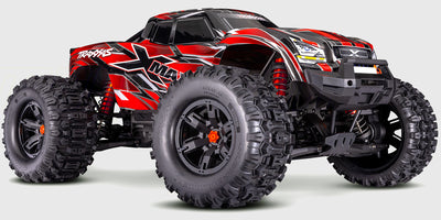 Grøn Traxxas X-Maxx 8S fjernstyret monster truck med bæltede Sledgehammer dæk klar til kørsel i terrænet.